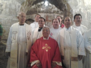 Group picture of Priests with the Bishop after Mass