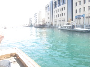 riding on a boat from dubai museum to thge other side - market